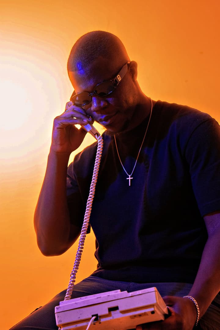 TAPIWA on an old telephone handset, lit in orange
